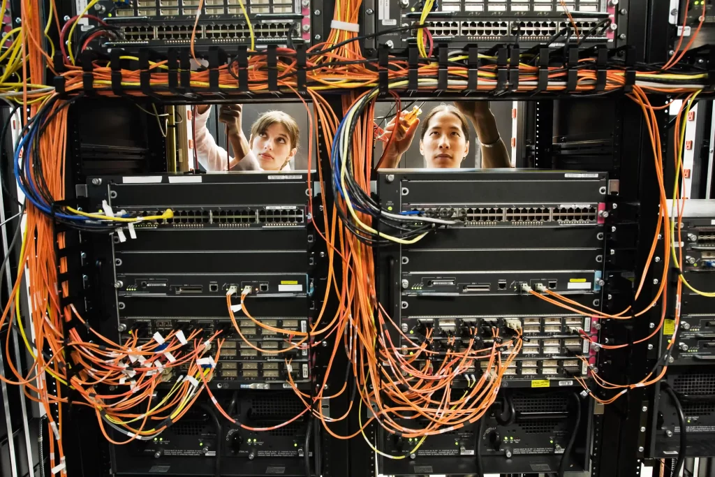 technicians-working-on-a-cat-5-cable-bundling-syst-2025-04-05-06-58-03-utc